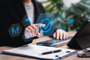Business Woman Touching Insurance Protection Icon Working on Laptop