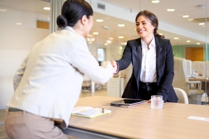 Businesswoman Shaking Hand with Insurance Agent