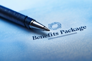 Benefits Package Documenst with a Pen Over Them