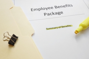 Employee Benefits Package Documents with Yellow Marker