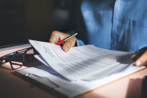 Broker Preparing Business Insurance Documents in His Office
